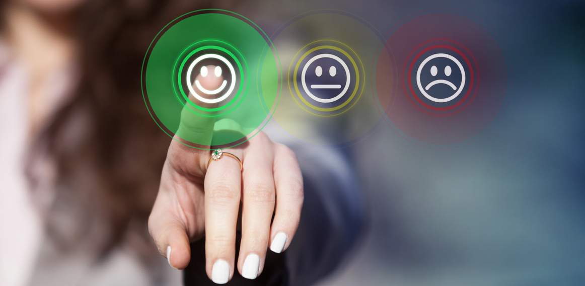 Finger touching happy face icon, suggesting a rating for the best remote support software